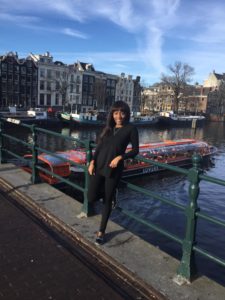 Maria Amupolo on her travels through Europe, standing at one of Amsterdam’s canals. 